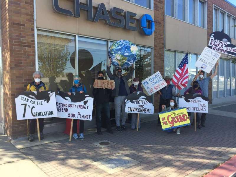 Chase Bank Demonstration, May 2021. Nine people with signs posing with the Chase logo.