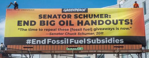 Workers install a billboard with a message for Senator Chuck Schumer a few blocks from his Prospect Park home. The billboard sends a clear message to Sen. Schumer: End Big Oil Handouts. In May 2011, Schumer said Òthe time to repeal these giveaways is nowÓ when talking about tax subsidies for big oil on the floor of the senate.