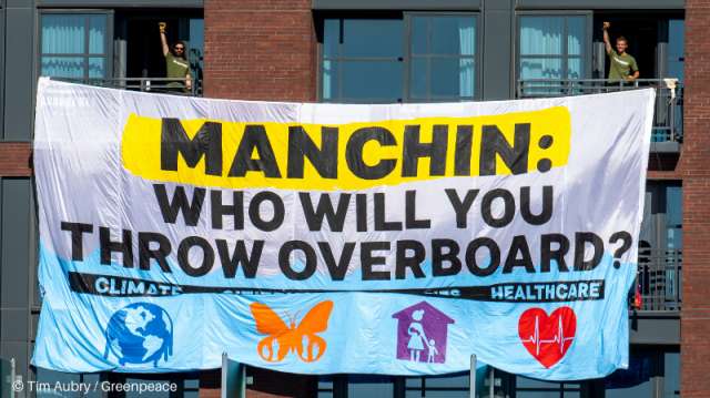 Banner proclaiming-Manchin: Who will you throw overboard?