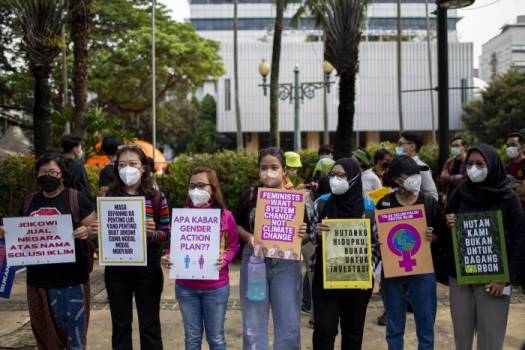 Young asian women holding signs.