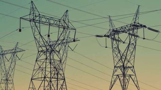 High-power lines against the sky.