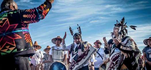 Indigenous gathering-Men in Feathers and Hats.