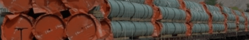 A large stack of pipes to be used for an oil pipeline.