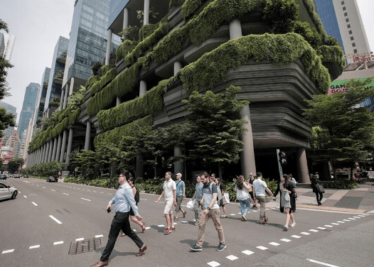 plants growing around a building to help with cooling.