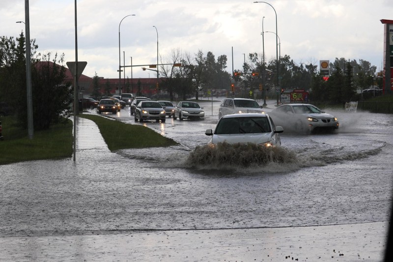 Flooded street with cars.